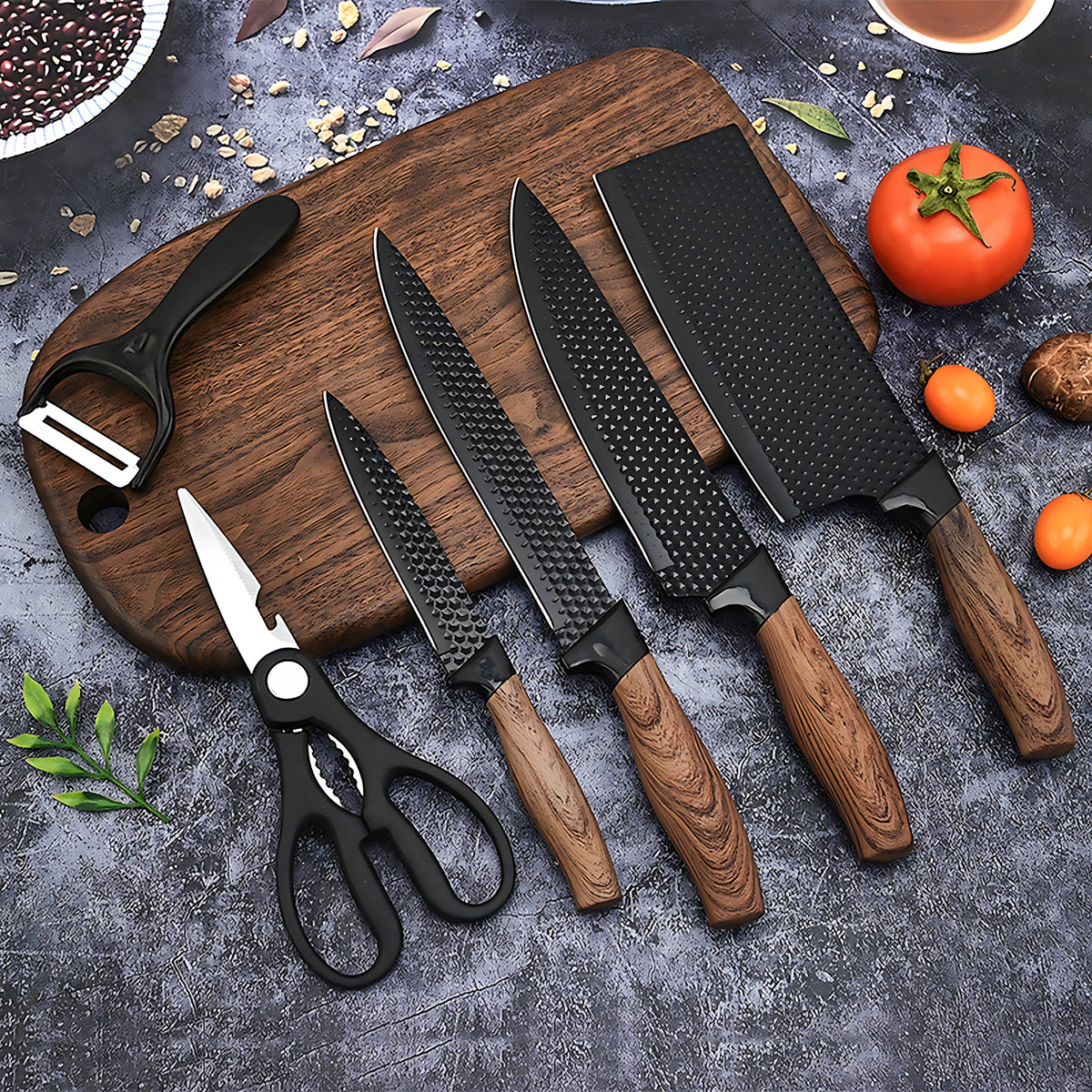 Edge knives, shears and peeler on a cutting board
